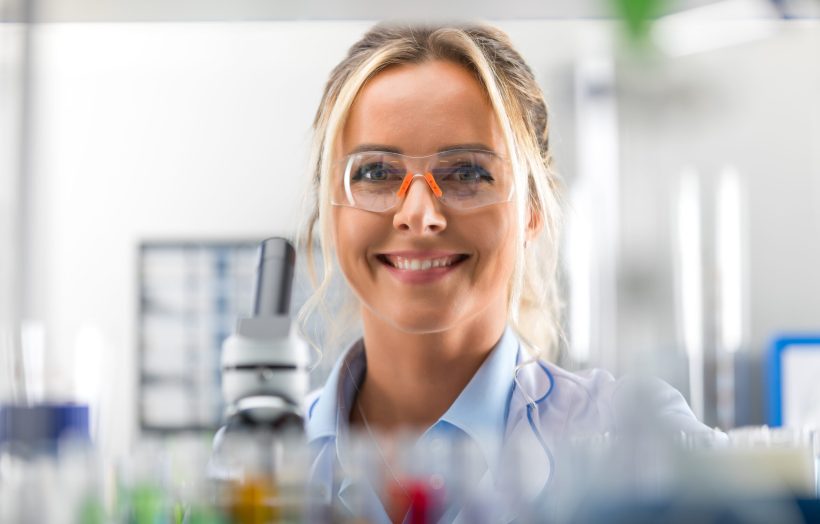 Portrait,Of,Happy,Young,Attractive,Smiling,Woman,Scientist,With,Protective